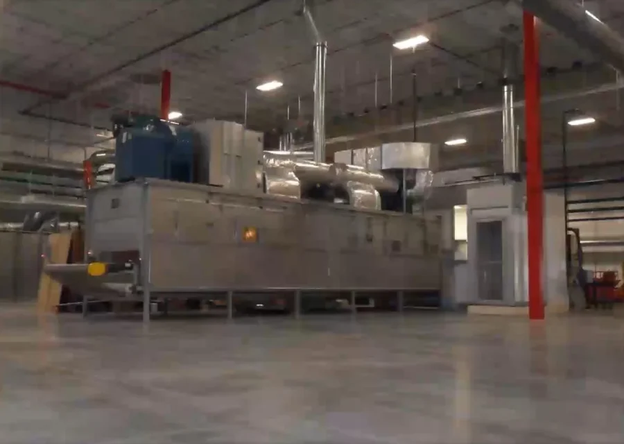 Stainless anti-haze coating booth and oven line installed in a large plant